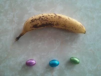 banana beside three Easter eggs:  same calorie value!